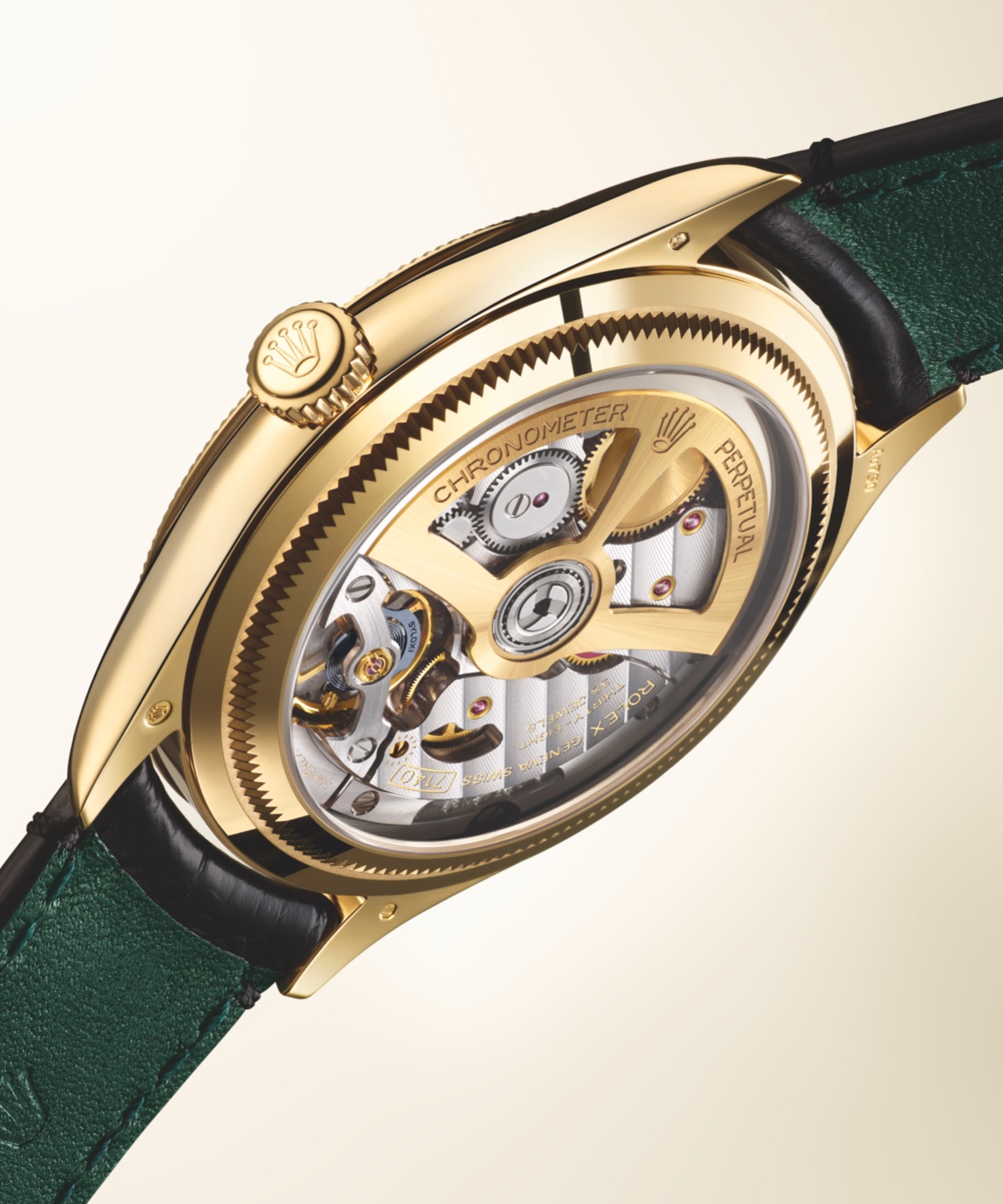 Rolex Perpetual 1908 in yellow gold showing transparent caseback revealing caliber 7140 movement with green alligator strap