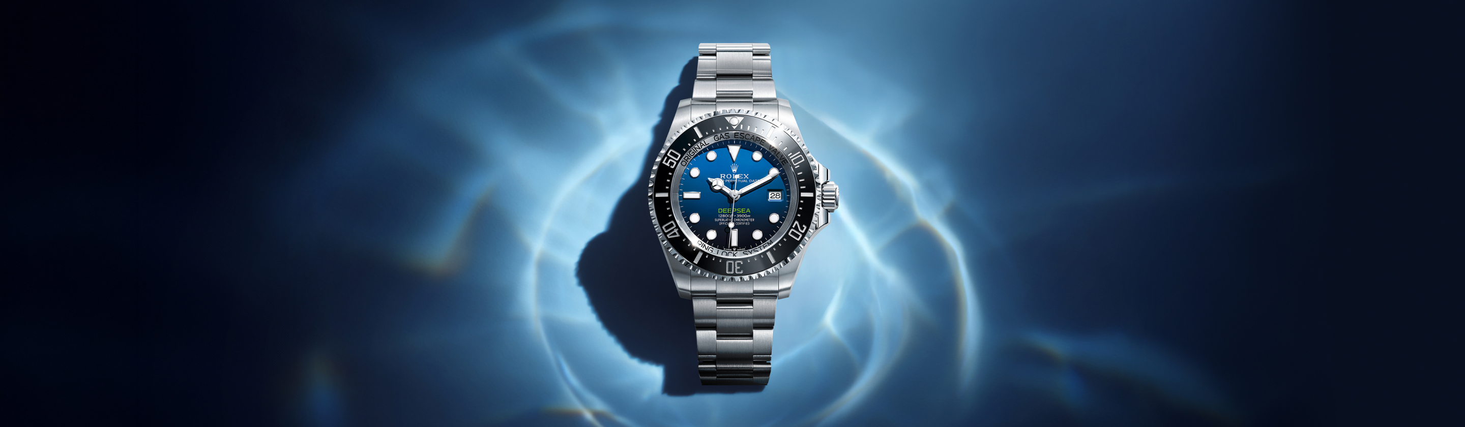 Rolex Deepsea in Oystersteel with D-blue dial and black Cerachrom bezel on an Oyster bracelet, against a deep blue underwater background