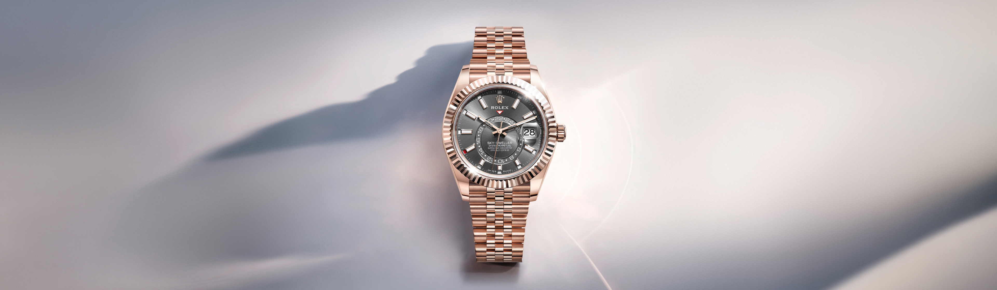 Close-up of the Rolex Sky-Dweller dial showing the Rolex crown, 24-hour disc and annual calendar month indicators