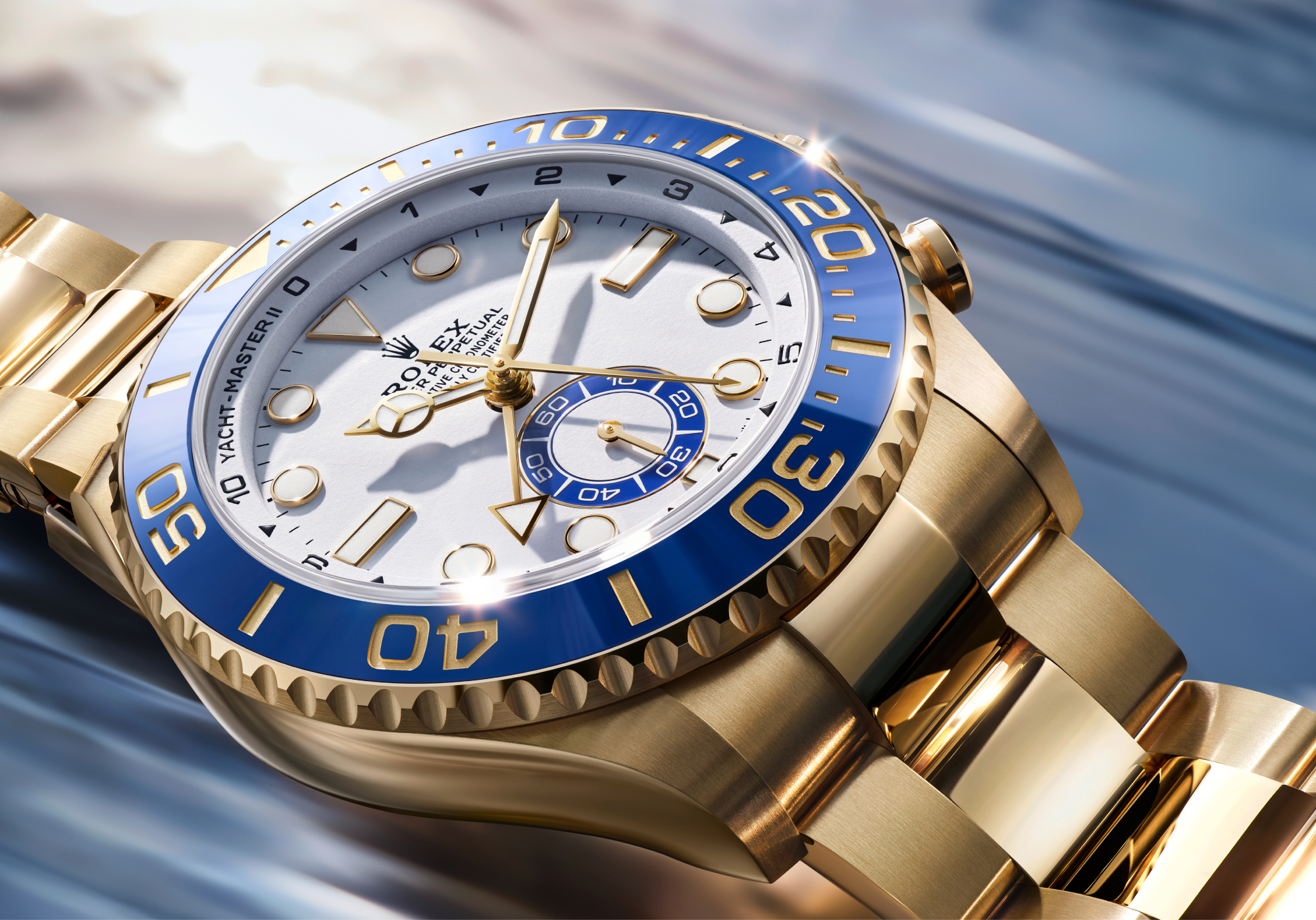Close-up of Rolex Yacht-Master II blue Cerachrom bezel insert with yellow gold numerals and graduations